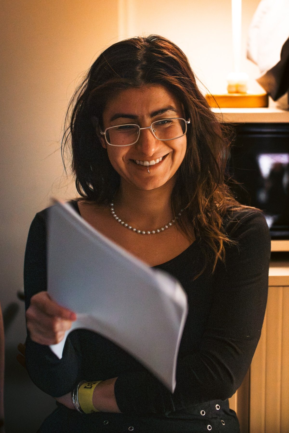 Yasaman Asgari working on set with script pages